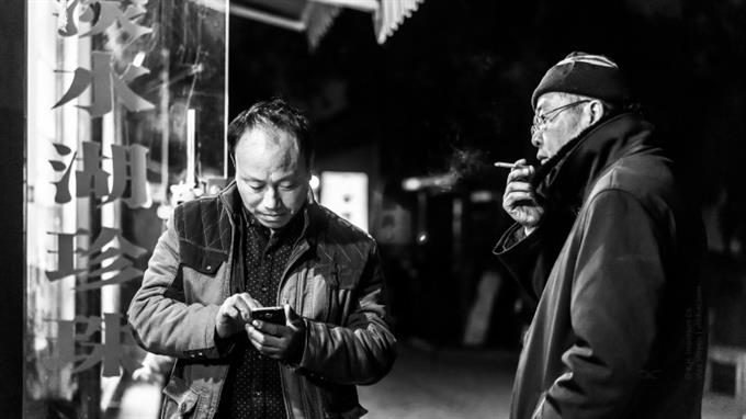 Rauchen in China: Trotz Verbot immer noch ein Gemeinschaftserlebnis.